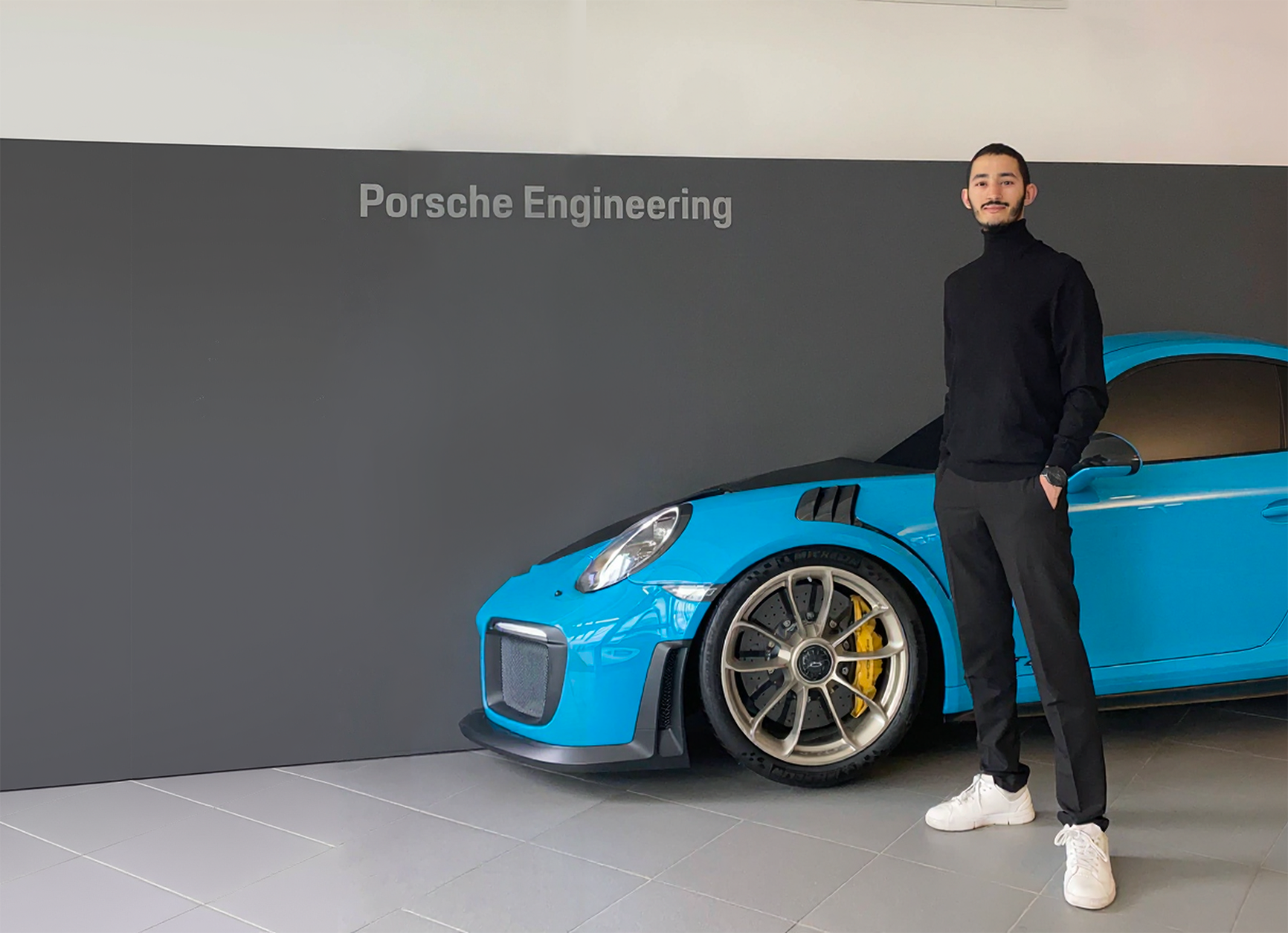 Fares Abassi at Porsche Engineering with Porsche sports car